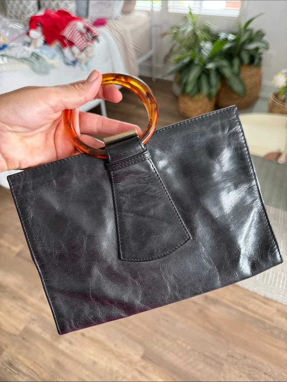 HOBO Black Leather Wristlet with Amber Tortoiseshell Ring Handle